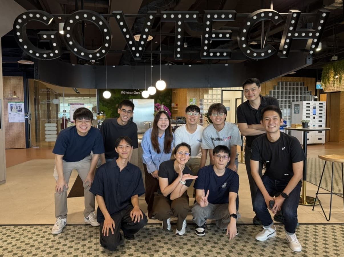 The GovTech intern cohort under the GovTech sign